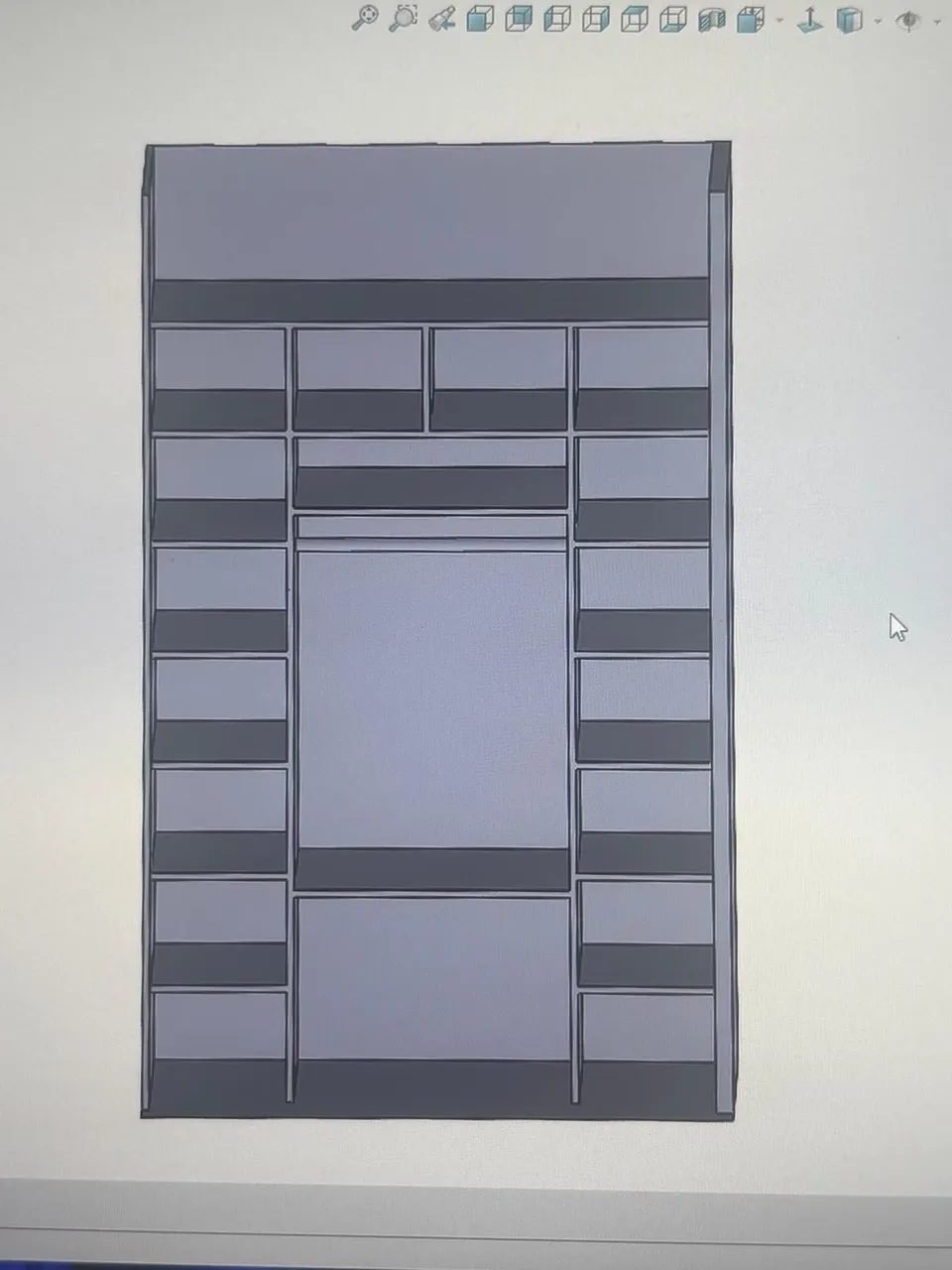 Plan 3D du dressing : casiers, penderie centrale et tiroirs.